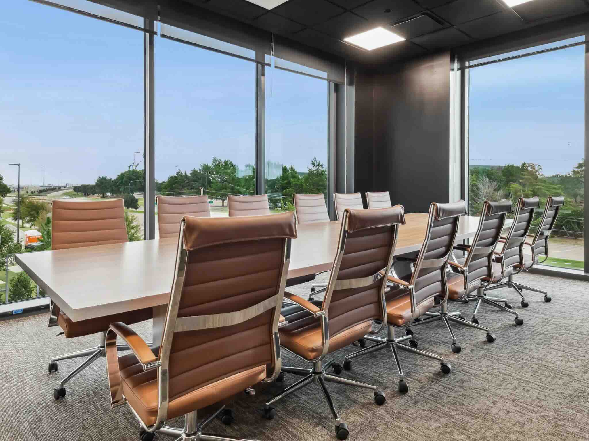 Large conference meeting room with panoramic city view windows at Lucid Private Offices Grapevine