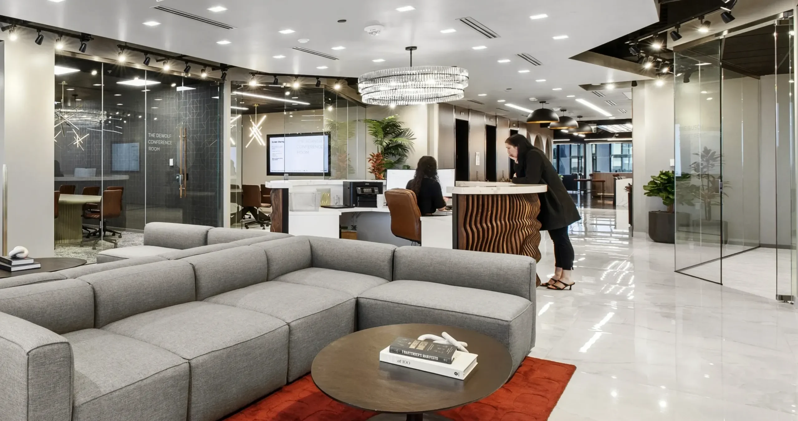 Reception and lounge area at Lucid Private Offices Nashville with community manager desk