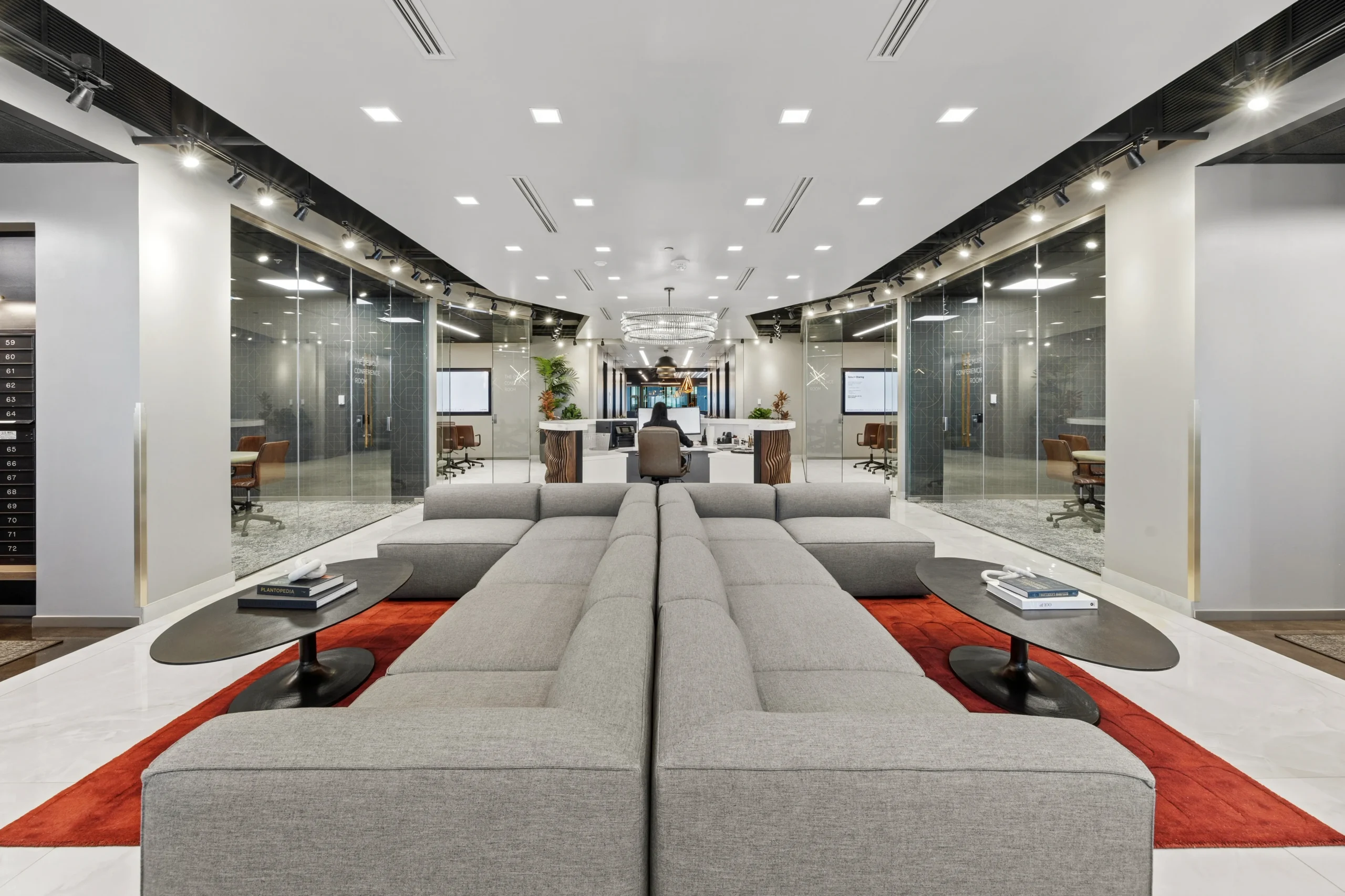 Front lobby with modular sectional and glass-walled conference rooms at 1801 West End Ave Nashville