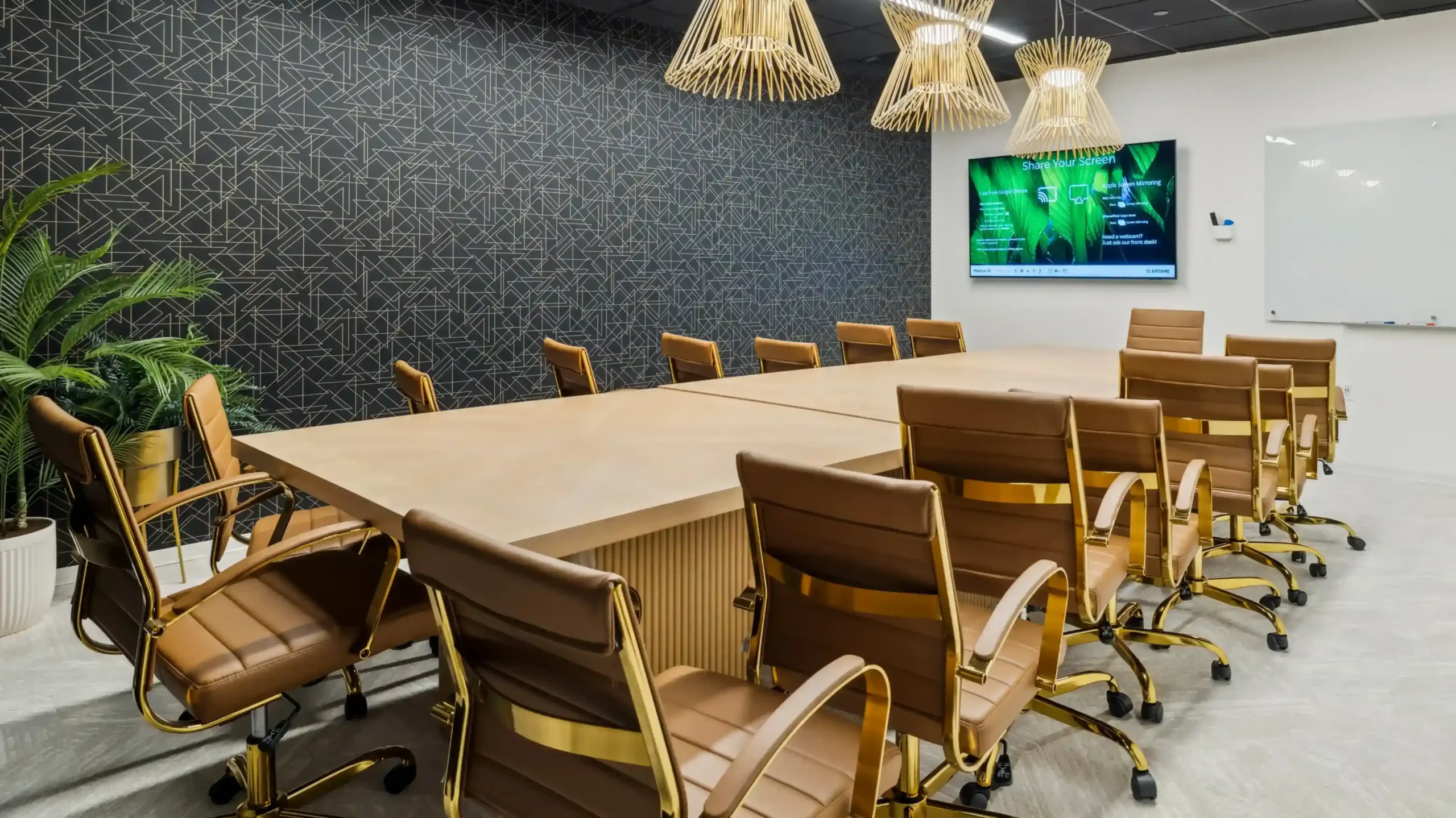 Private office with desks, task chairs, and framed artwork on white walls