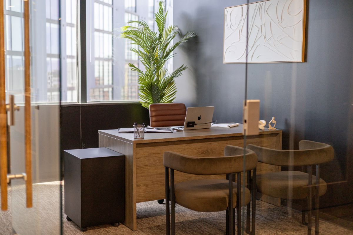 Window office with guest seating at Lucid Private Offices